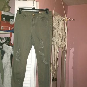 Olive green ripped jeans.